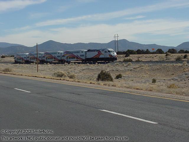 The Rail Runner Commuter Train runs through Belen, Los Lunas, Albuquerque, Rio Rancho, and up to Santa Fe. We spotted it in March 2012 along I-25 just N of Albuquerque by Rio Rancho!